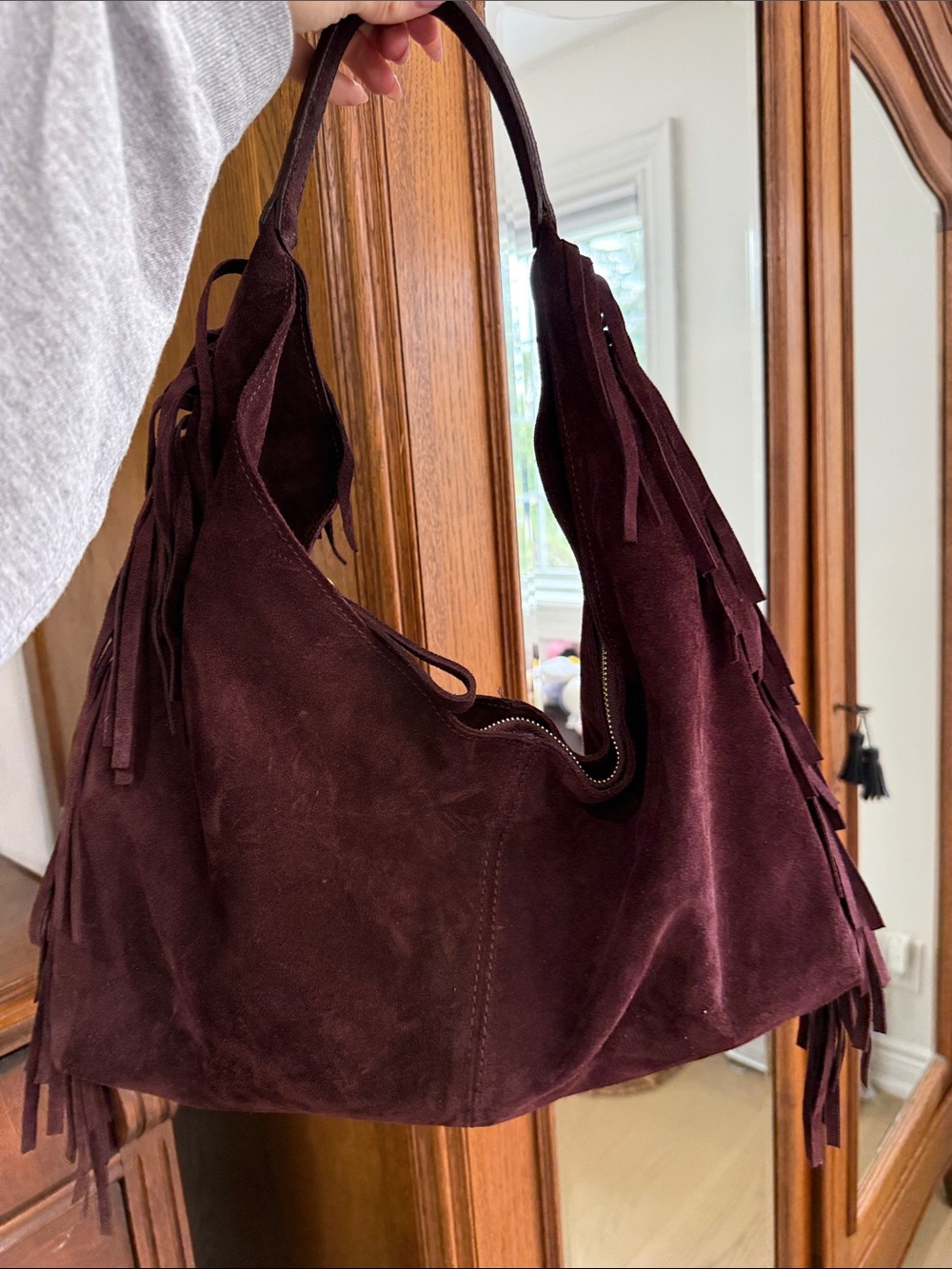 Suede burgundy leather handbag with fringe